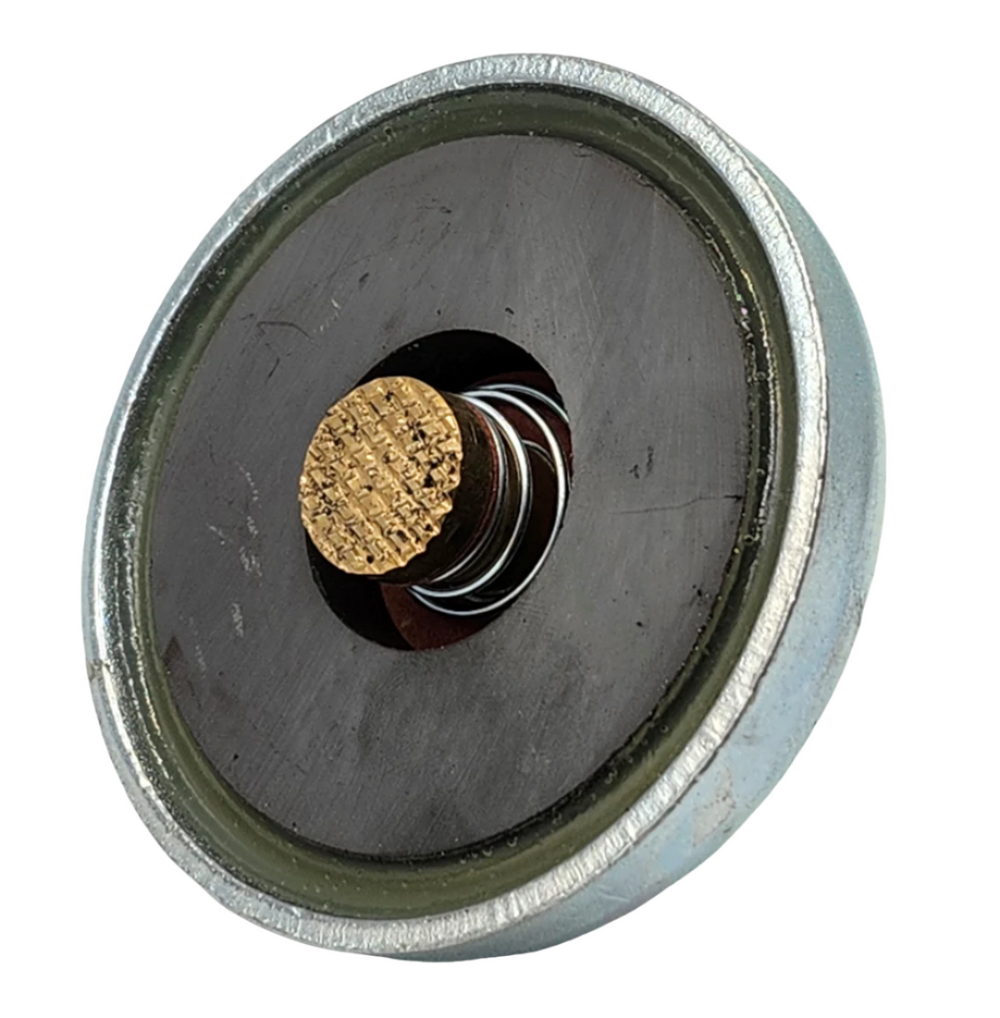 PowerWeld magnetic ground clamp, top view of round magnet face with brass contact