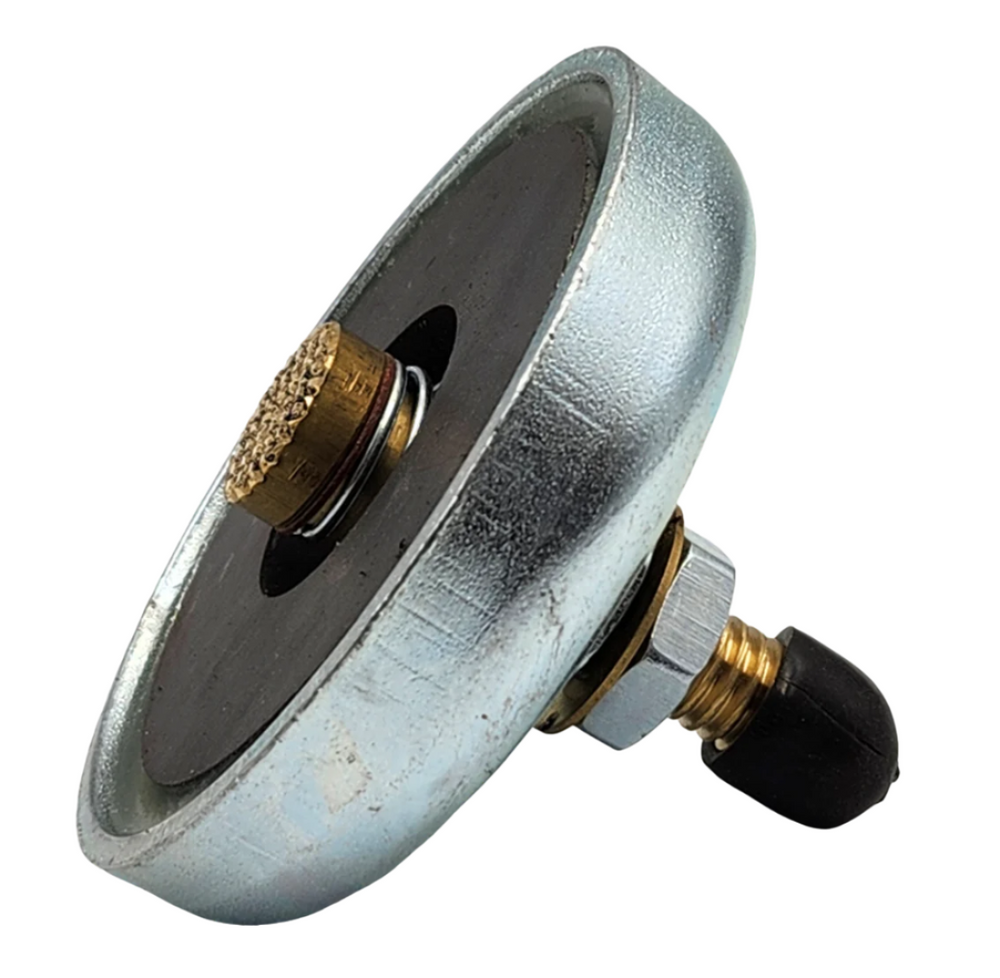 PowerWeld magnetic ground clamp, angled view showing cable connection stud and rubber boot