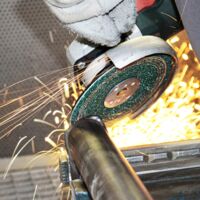 VSM AF799 Actirox ceramic abrasive disc mounted on angle grinder